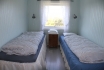 Schlafzimmer mit Einzelbetten in Kveldheim
